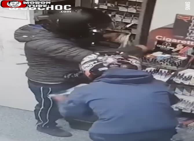 Video :Two males use their motorcycles to smash a store window in order to steal cigarettes and booze